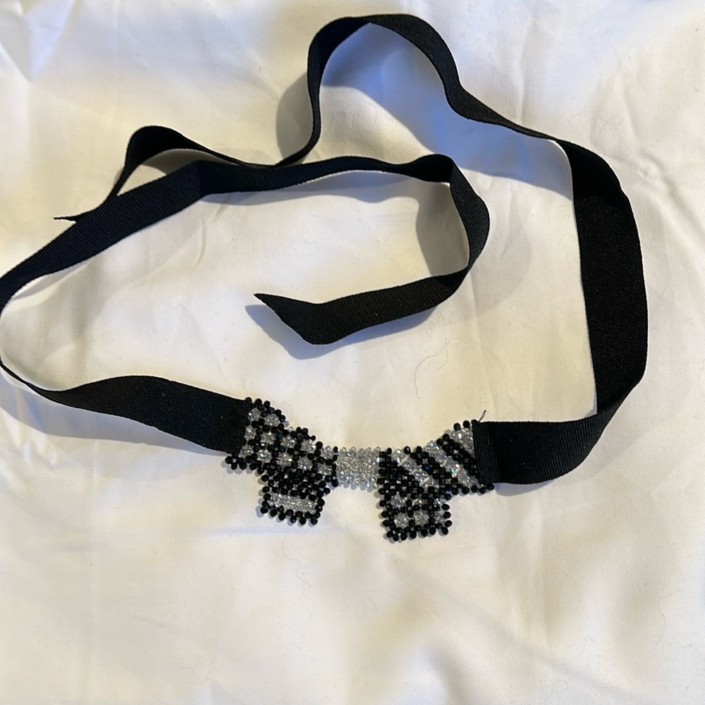 Beautiful self-tie necklace. Black & clear stones on a bow on grossgrain ribbon.